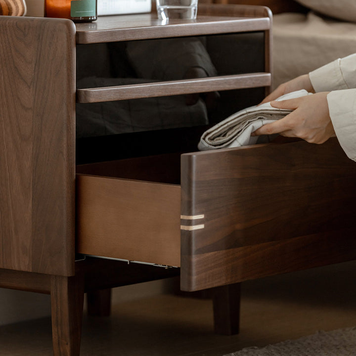 Japandi walnut wood side table dusk in close up details.