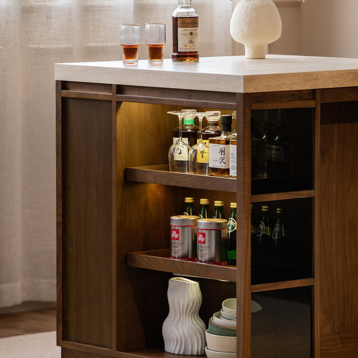 Japandi walnut wood sintered stone island dining table with cabinet axis in details.