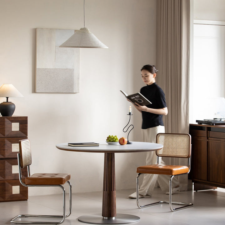 Japandi walnut wood sintered stone round dining table grey in real life style.