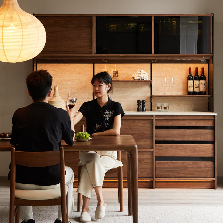 Japandi walnut wood sintered stone storage side cabinet axis in still life.