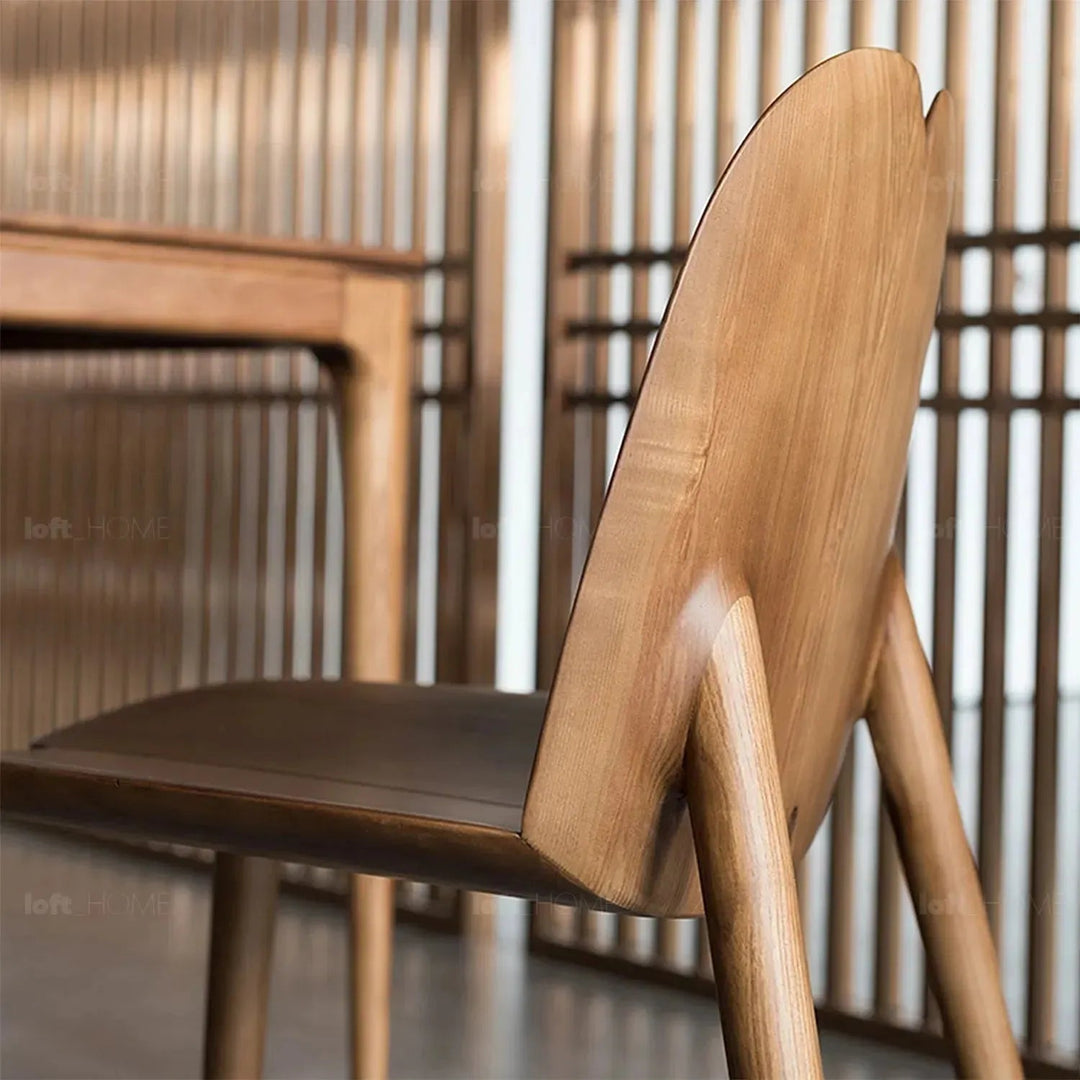 Japandi wood dining chair pulp layered structure.