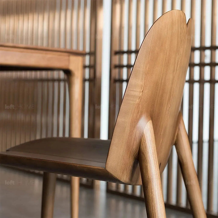 Japandi wood dining chair pulp layered structure.