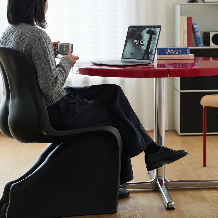 Minimalist abs steel round dining table donut with context.