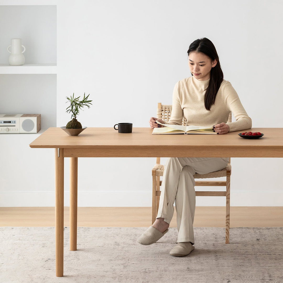 Minimalist ash wood dining table borel in real life style.