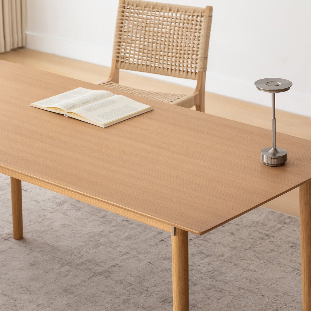 Minimalist ash wood dining table borel in close up details.