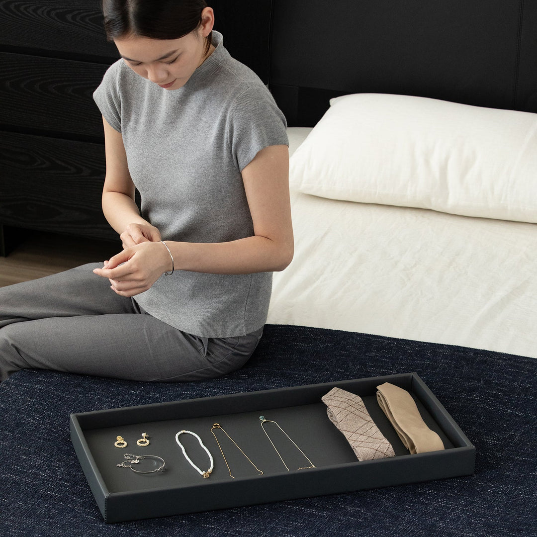 Minimalist ash wood veneer chest of 4  drawers grid in details.