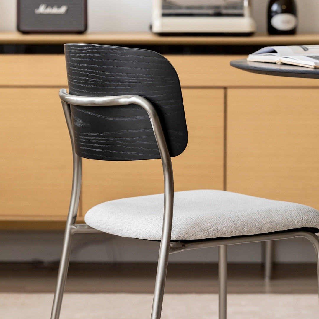 Minimalist ash wood veneer cotton fabric dining chair black aeri in details.