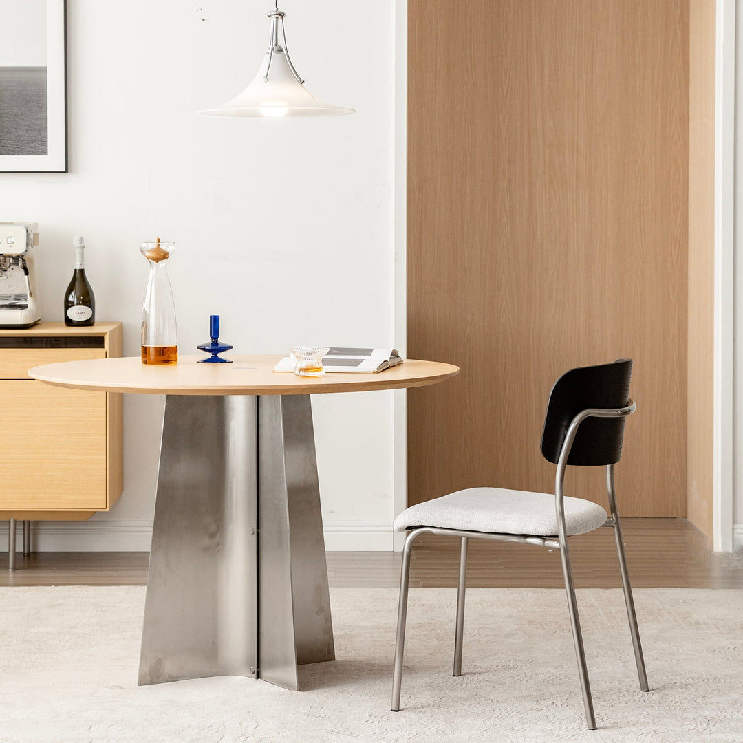 Minimalist ash wood veneer cotton fabric dining chair black aeri in close up details.