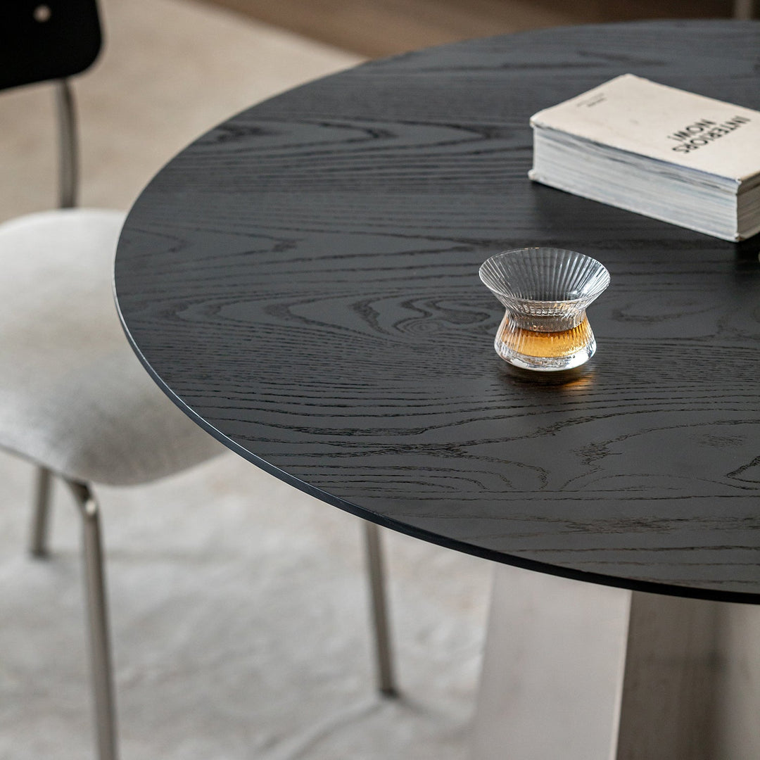 Minimalist ash wood veneer stainless steel round dining table black aeri material variants.