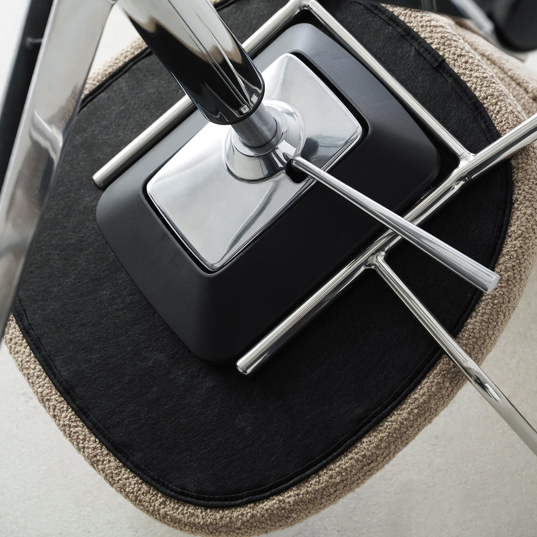 Minimalist boucle fabric study chair aodo in close up details.