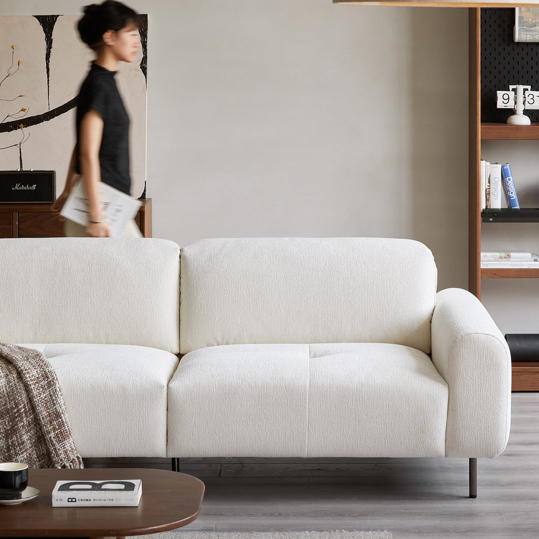 Minimalist chenille velvet fabric 3 seater sofa drift with context.