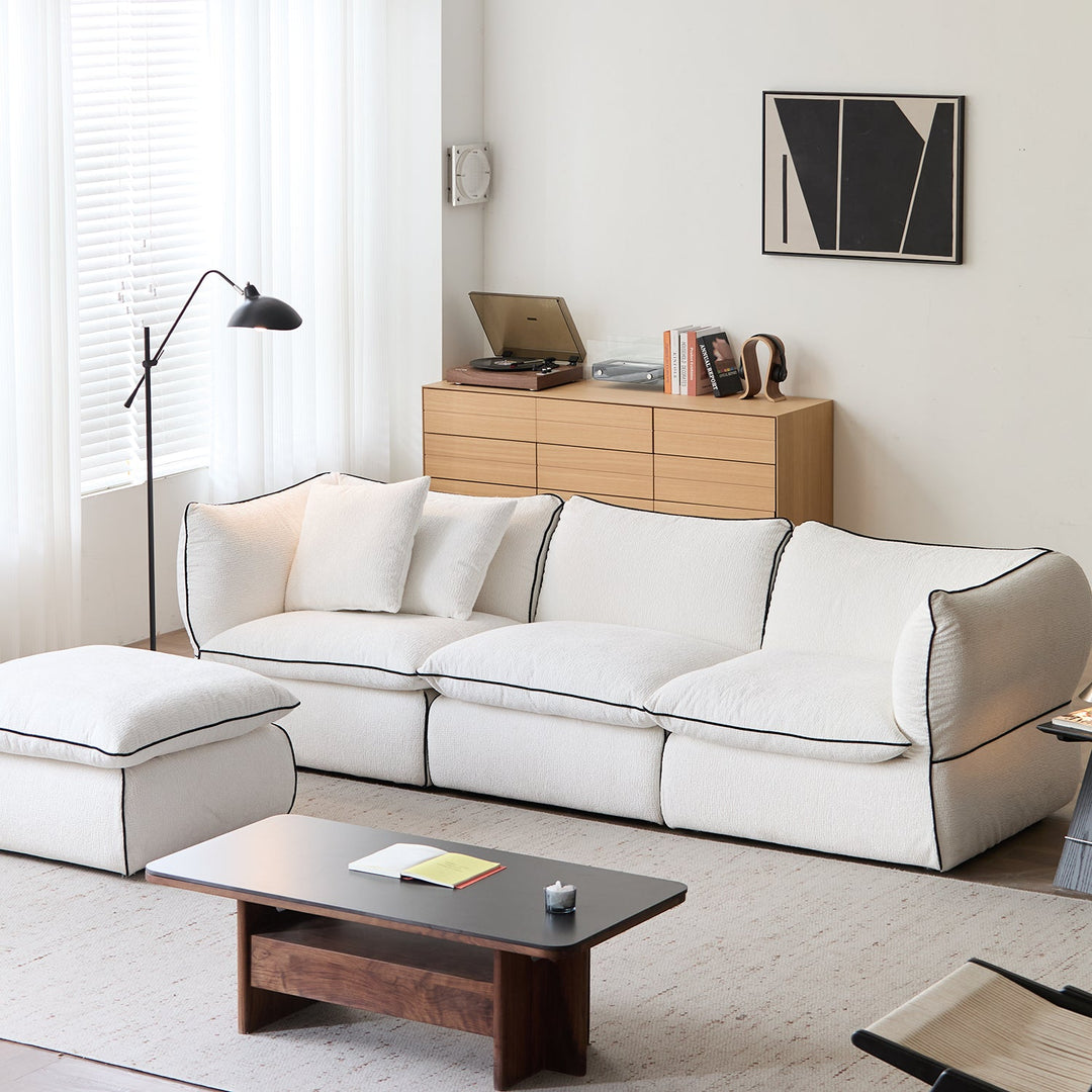 Minimalist chenille velvet fabric 4 seater sofa cloud in close up details.