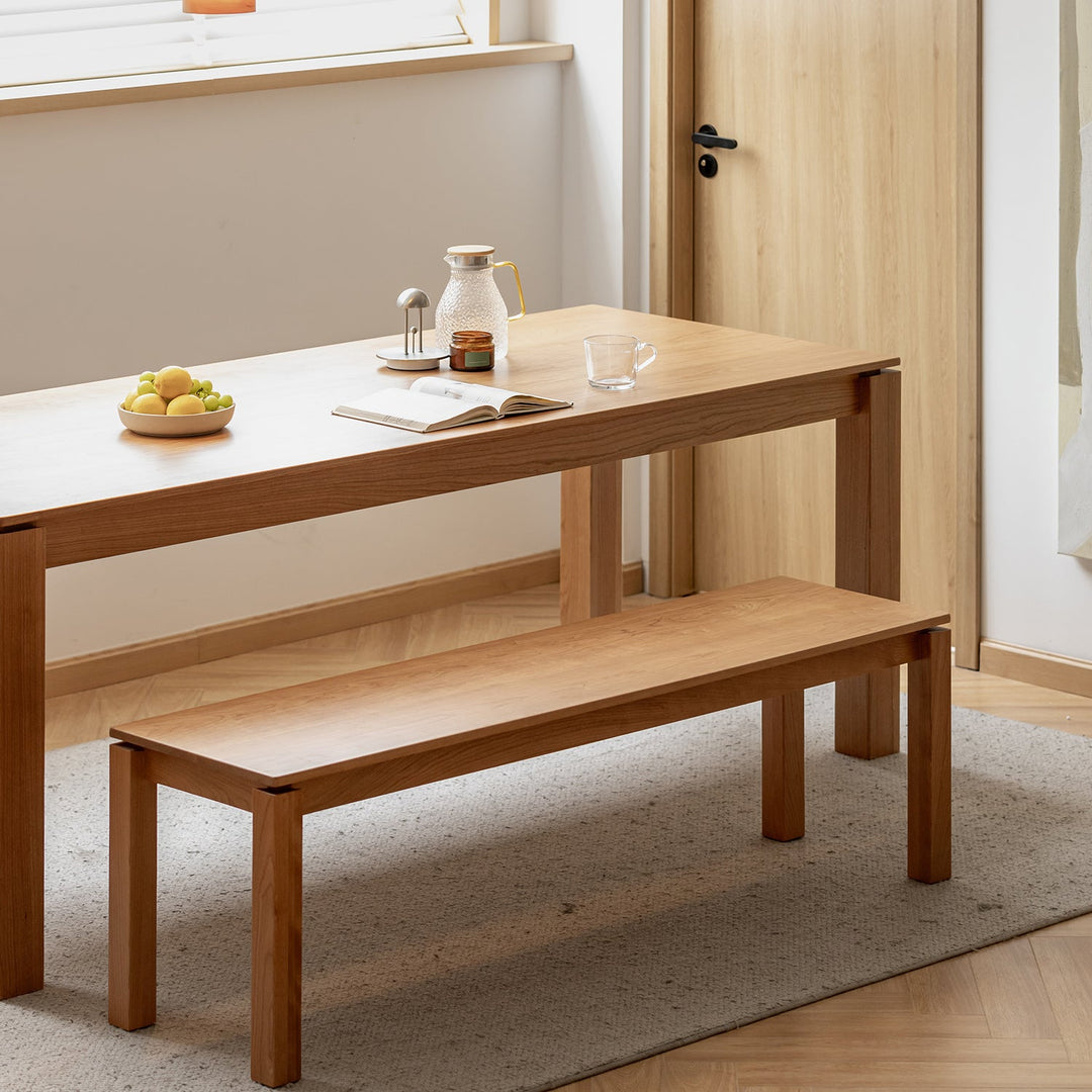 Minimalist cherry wood dining bench coastal in panoramic view.