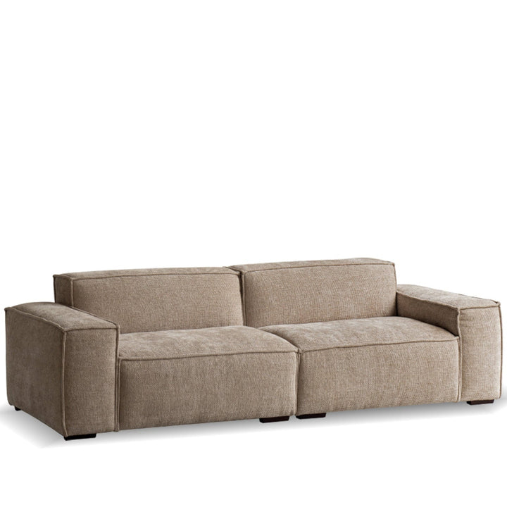 Minimalist linen fabric 3 seater sofa camaleonda in white background.