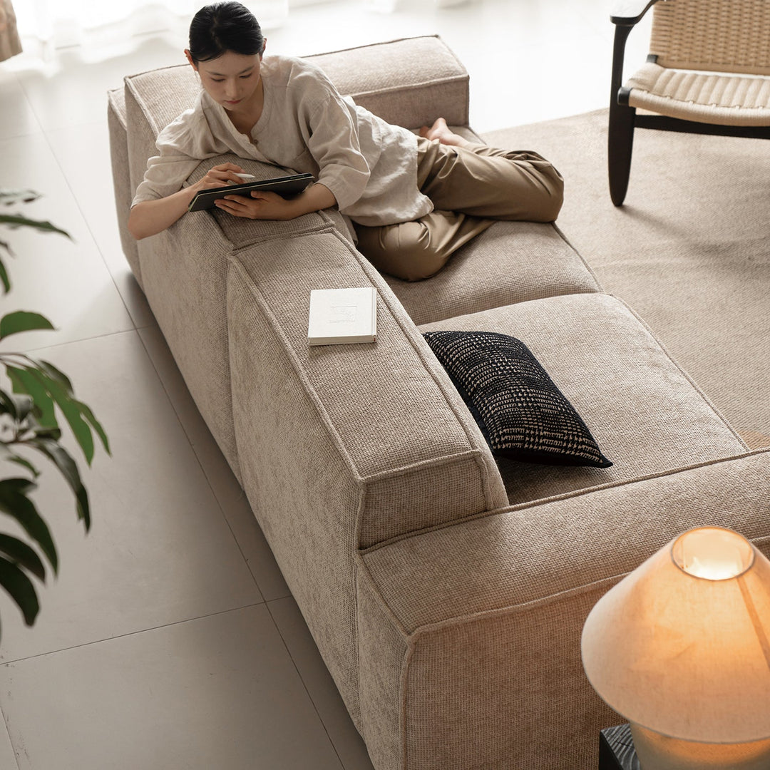 Minimalist linen fabric 3 seater sofa camaleonda in close up details.