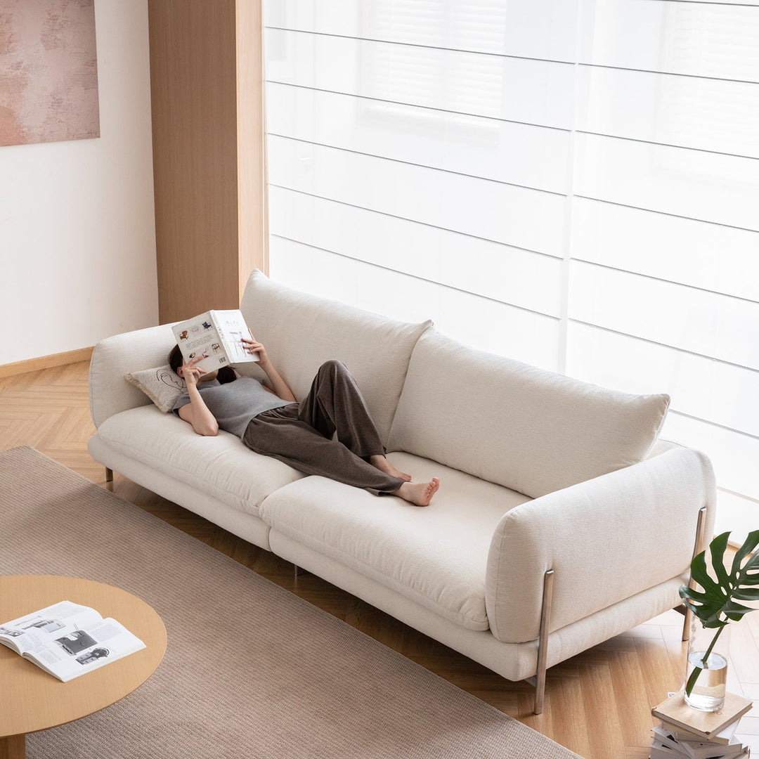 Minimalist cotton fabric 4 seater sofa como with context.