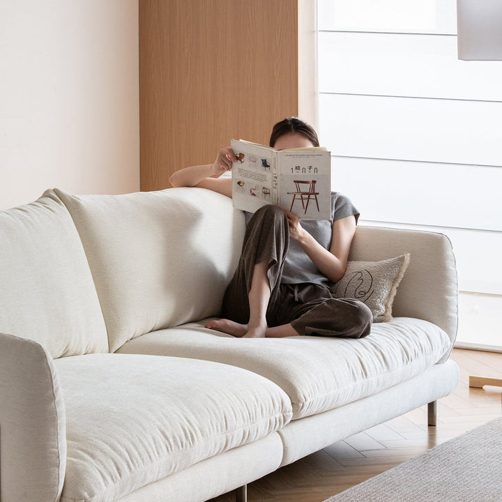 Minimalist cotton fabric 4 seater sofa como in close up details.