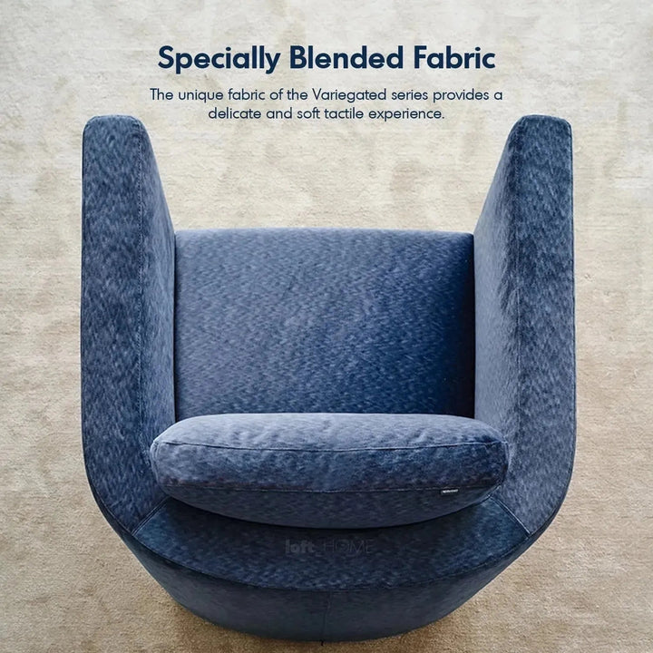 Minimalist fabric 1 seater revolving sofa variegated in panoramic view.