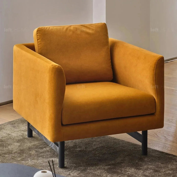 Minimalist fabric 1 seater sofa nor with context.