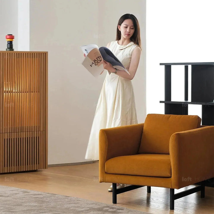 Minimalist fabric 1 seater sofa nor in panoramic view.
