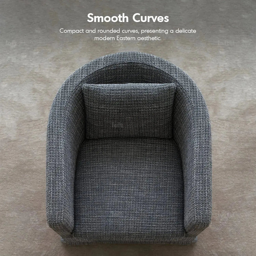 Minimalist fabric 1 seater sofa yan in still life.