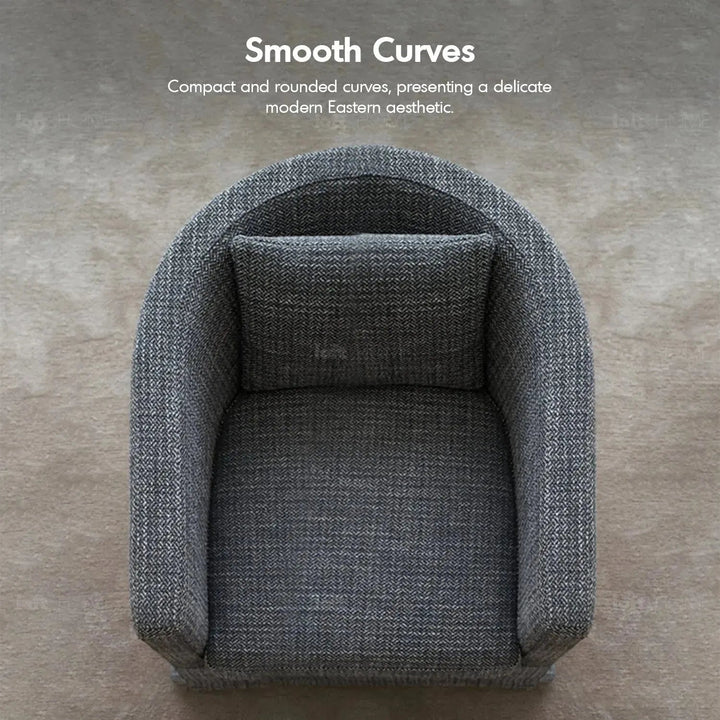 Minimalist fabric 1 seater sofa yan in still life.