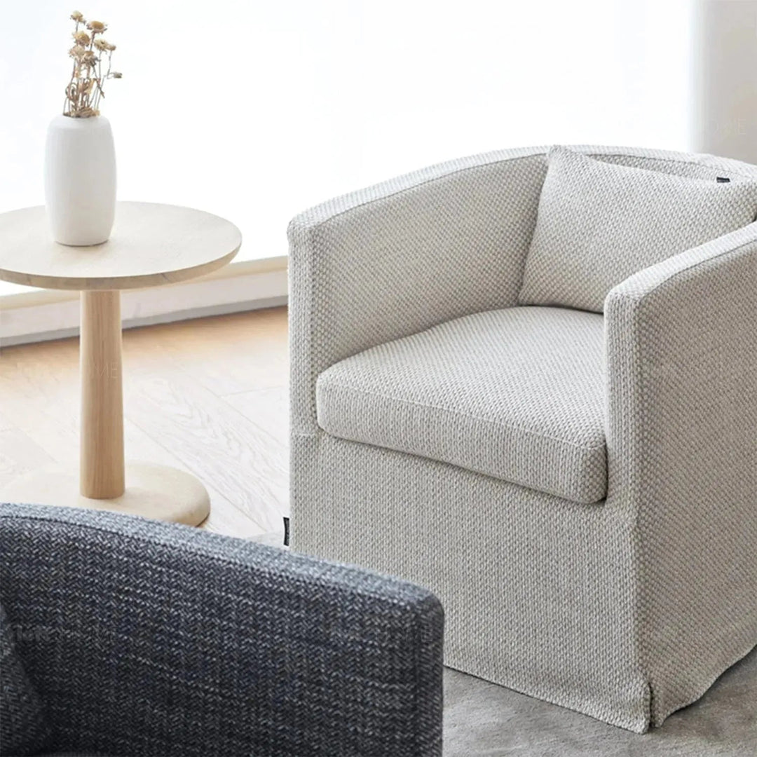 Minimalist fabric 1 seater sofa yan with context.