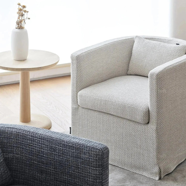 Minimalist fabric 1 seater sofa yan with context.