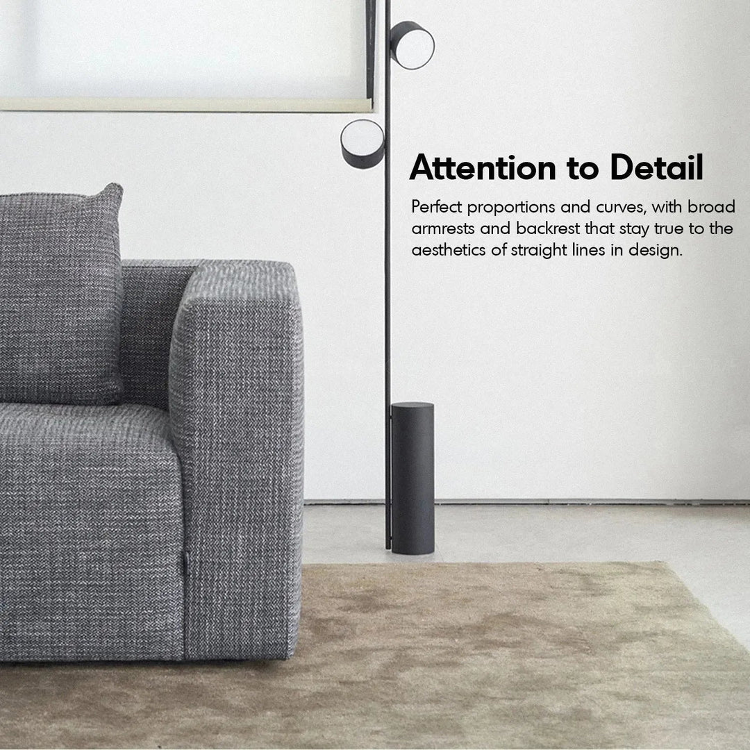 Minimalist fabric 2 seater sofa bri with context.