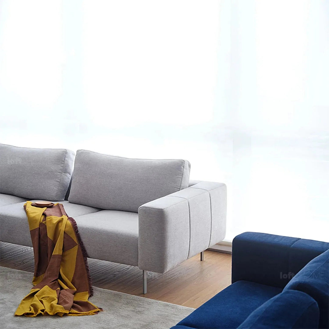 Minimalist fabric 3 seater sofa amalf in close up details.