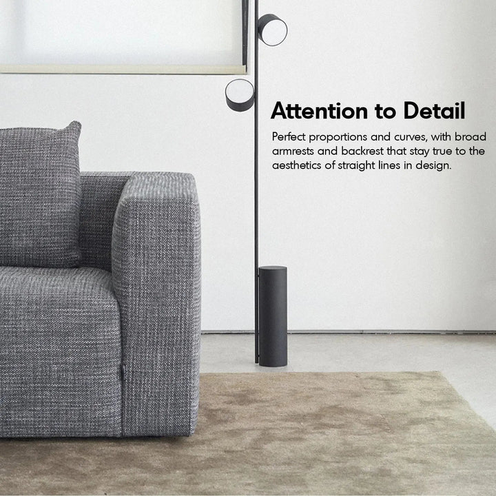 Minimalist fabric 3 seater sofa bri with context.