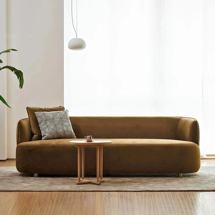 Minimalist fabric 3 seater sofa heb with context.