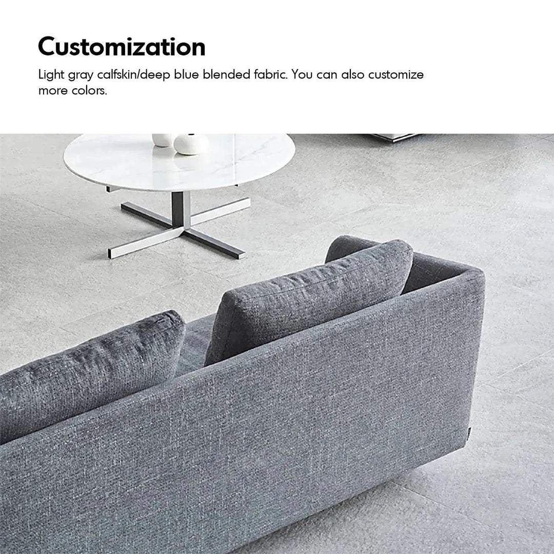 Minimalist fabric 3 seater sofa mlini with context.
