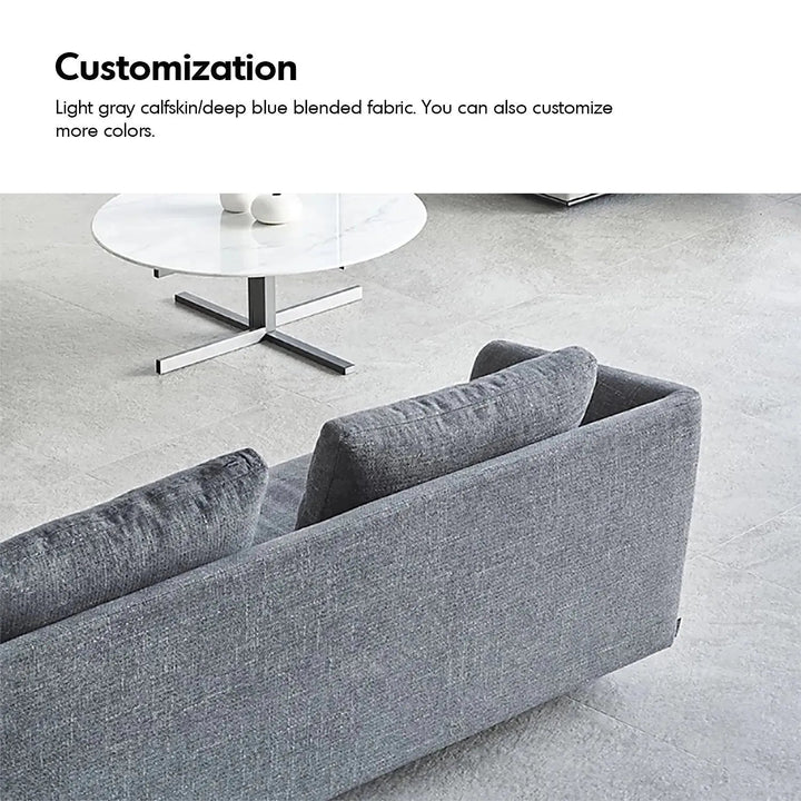 Minimalist fabric 3 seater sofa mlini with context.