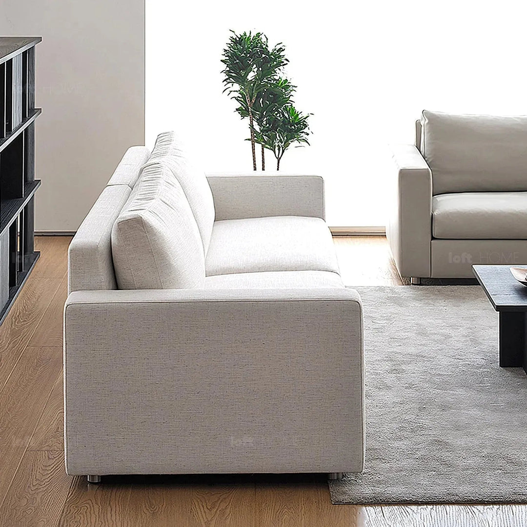 Minimalist fabric 3 seater sofa white with context.
