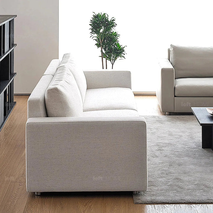 Minimalist fabric 3 seater sofa white with context.