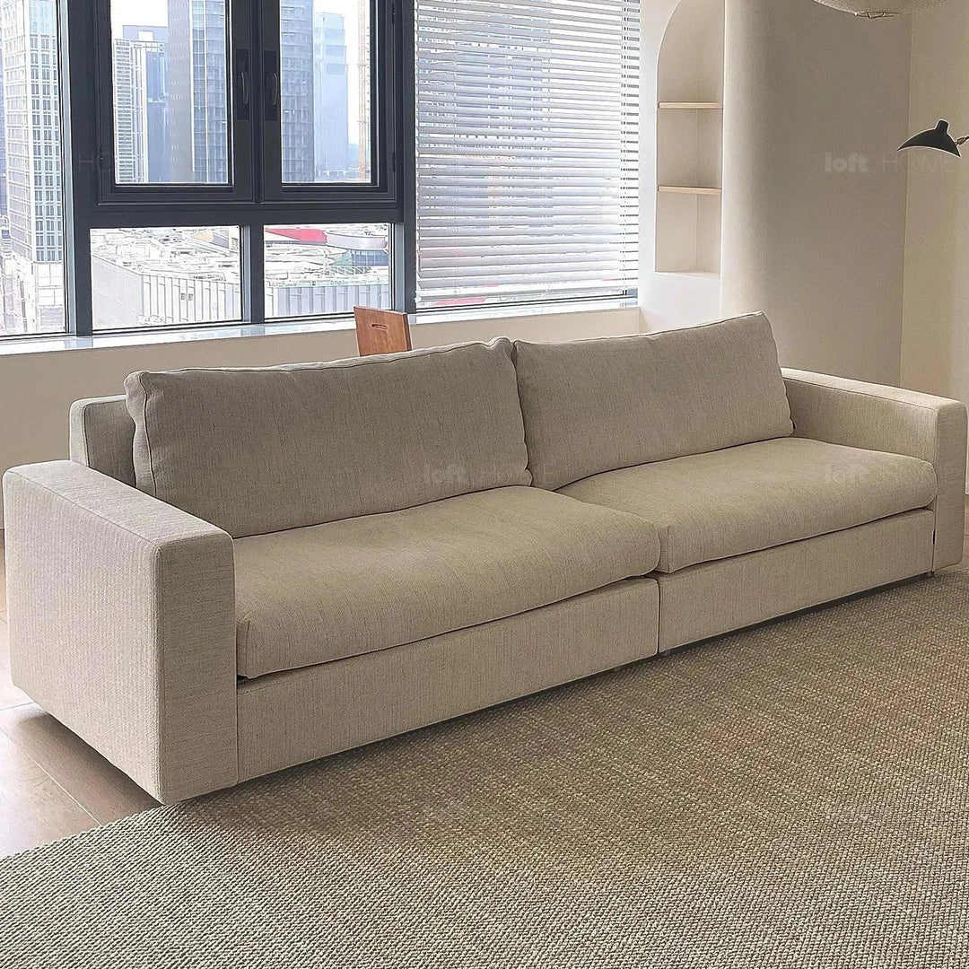 Minimalist fabric 3 seater sofa white in still life.
