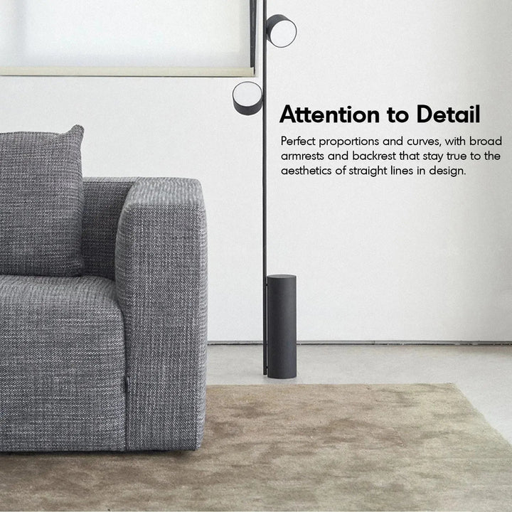 Minimalist fabric 3.5 seater sofa bri with context.