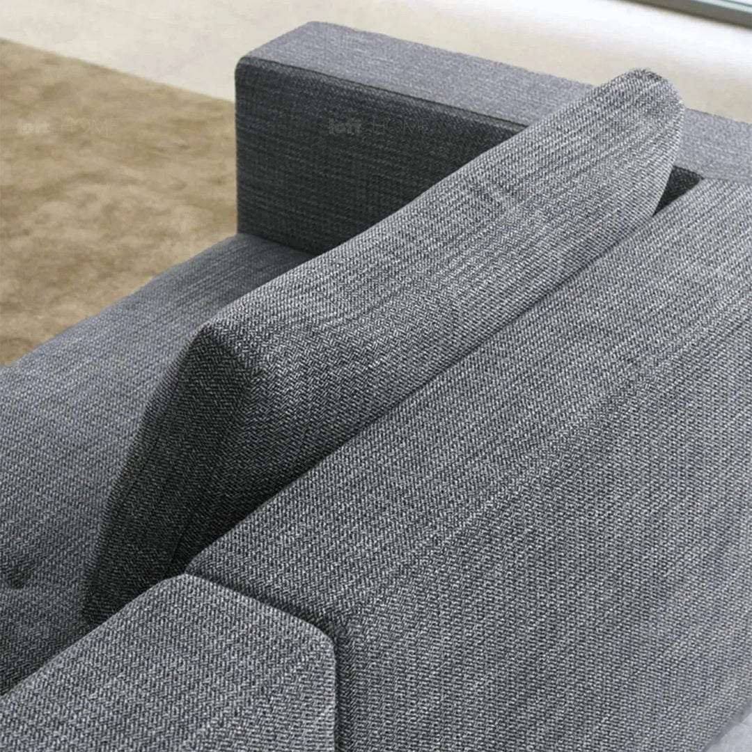 Minimalist fabric 3.5 seater sofa bri in still life.