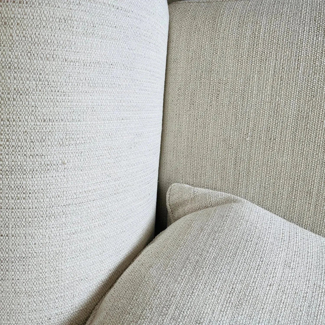 Minimalist fabric 4 seater sofa flower in still life.