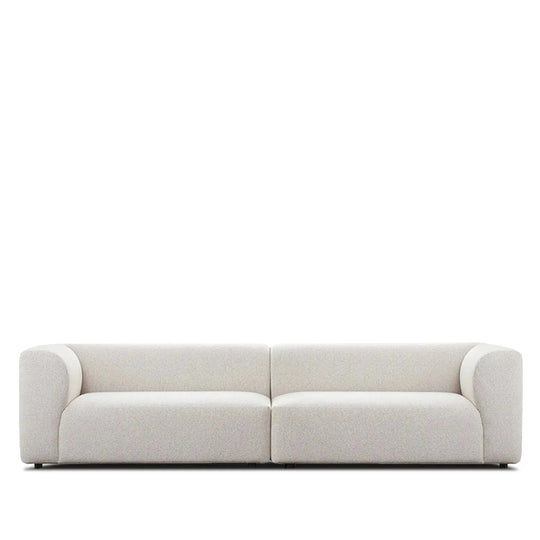 Minimalist fabric 4 seater sofa flower in white background.