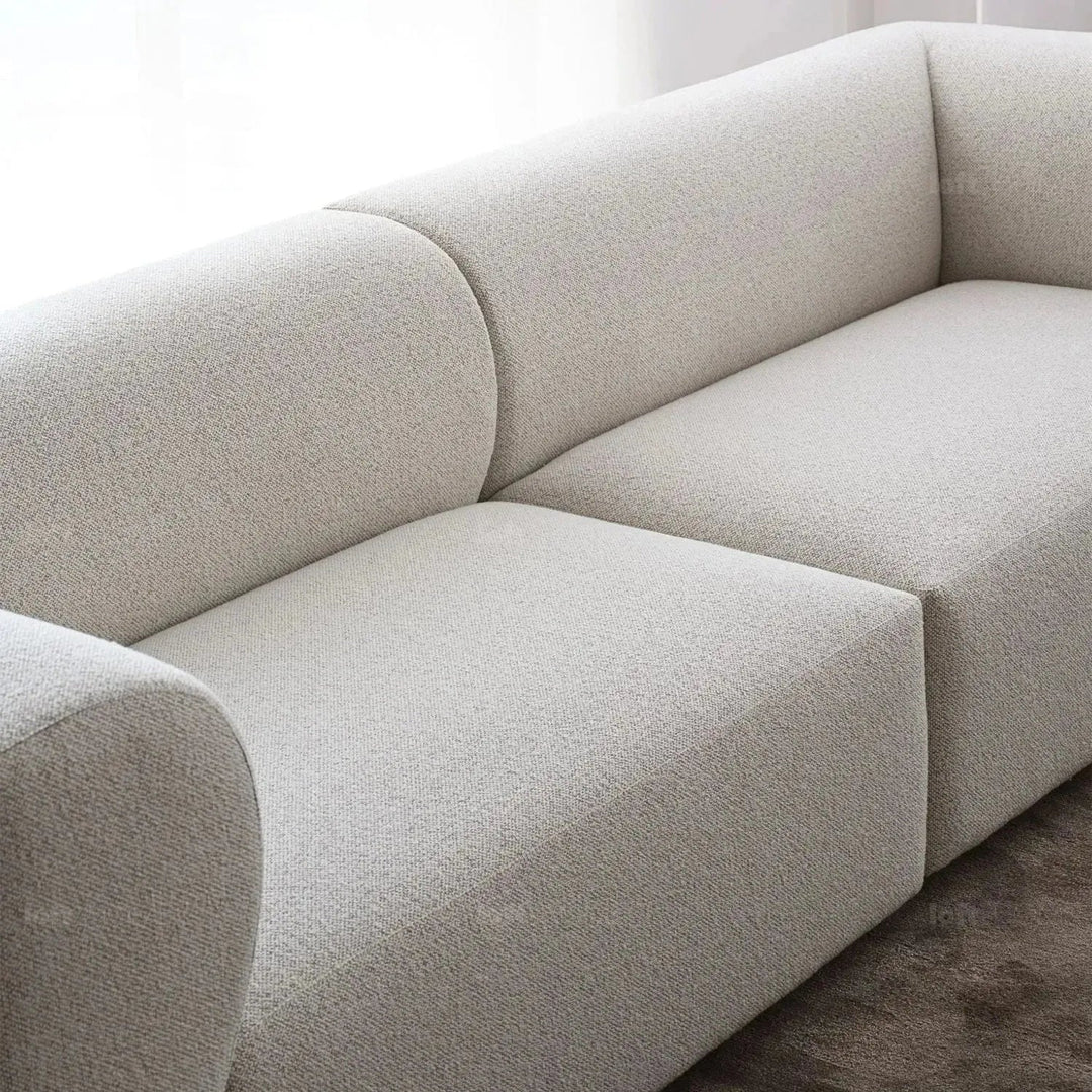 Minimalist fabric 4 seater sofa flower in details.