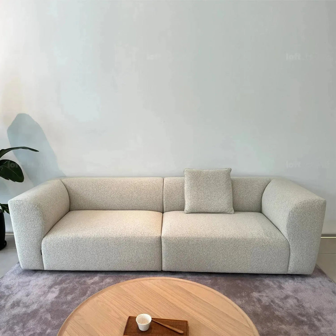 Minimalist fabric 4 seater sofa flower in panoramic view.