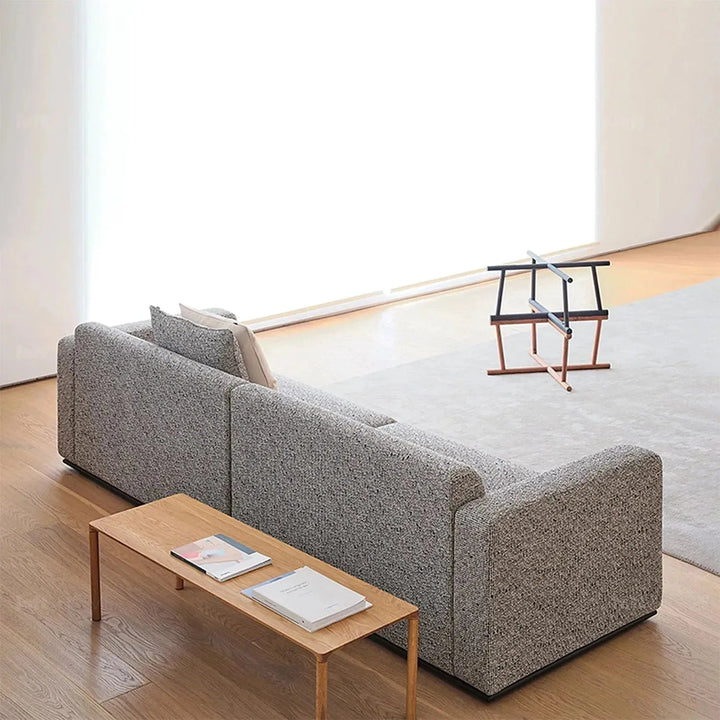 Minimalist fabric 4 seater sofa nemo in still life.