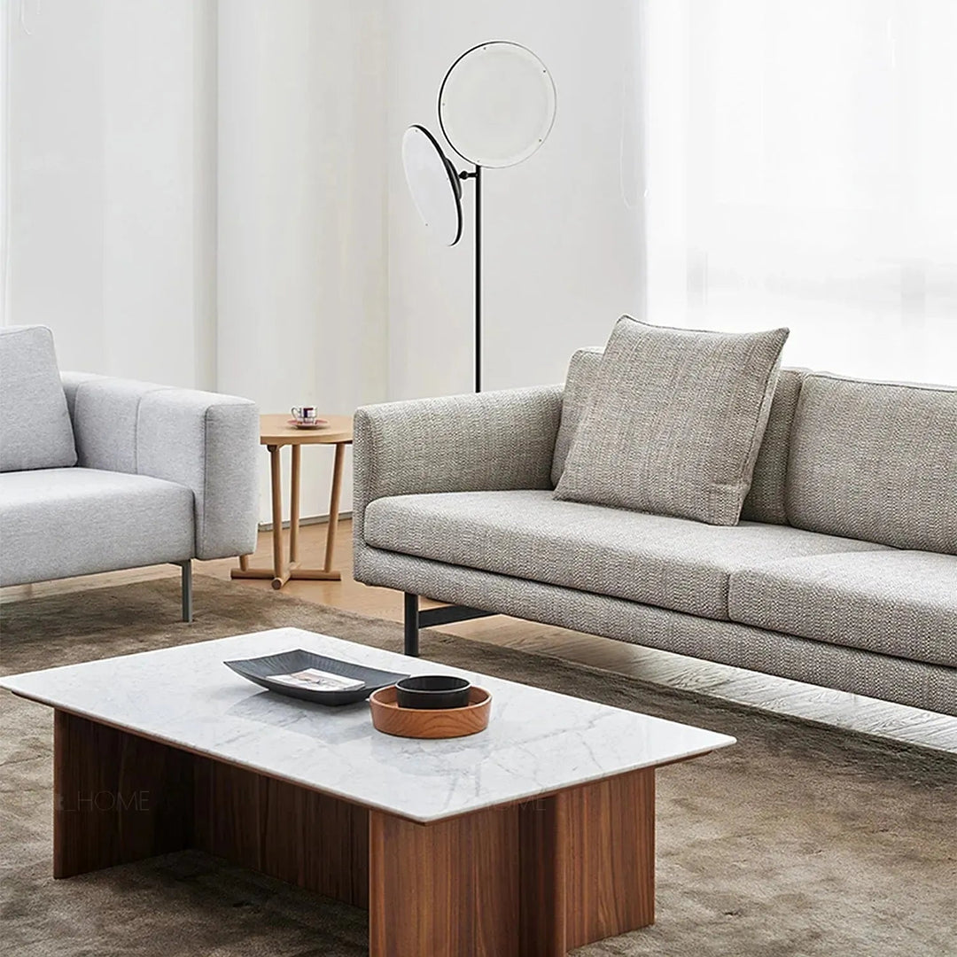 Minimalist fabric 4 seater sofa nor in panoramic view.
