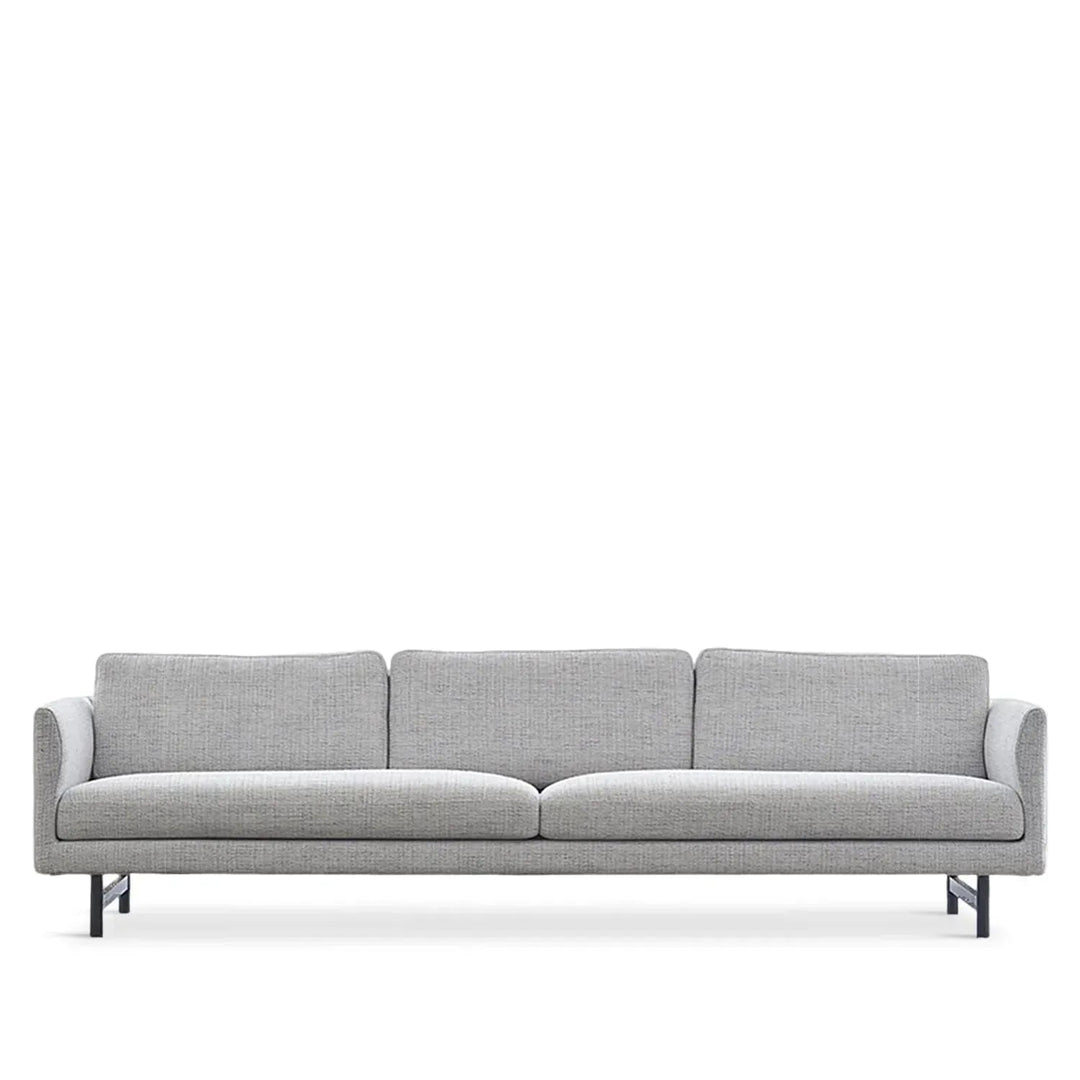 Minimalist fabric 4 seater sofa nor in white background.