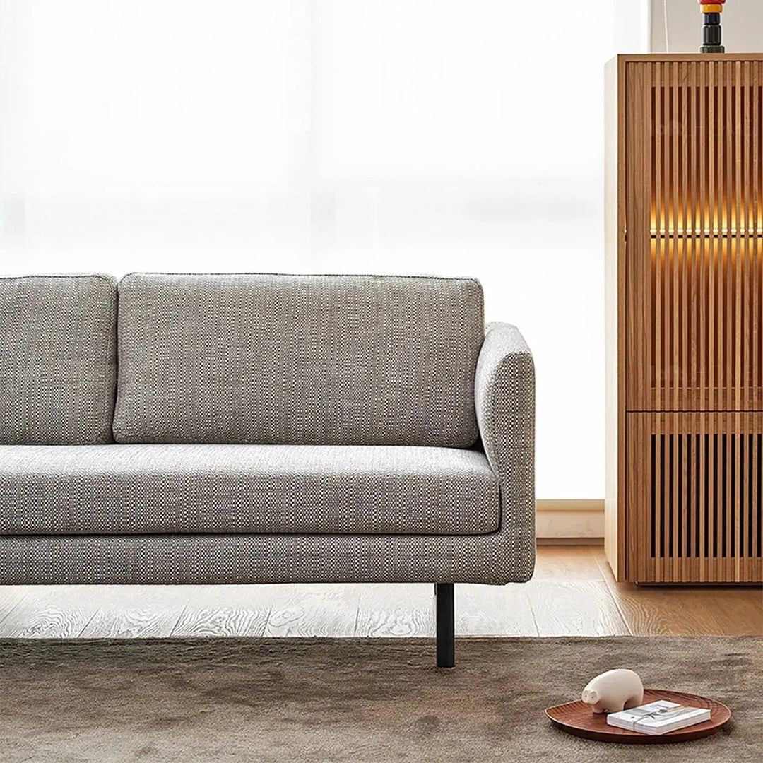 Minimalist fabric 4 seater sofa nor in still life.