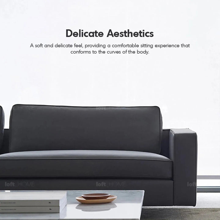 Minimalist fabric 4 seater sofa vemb with context.