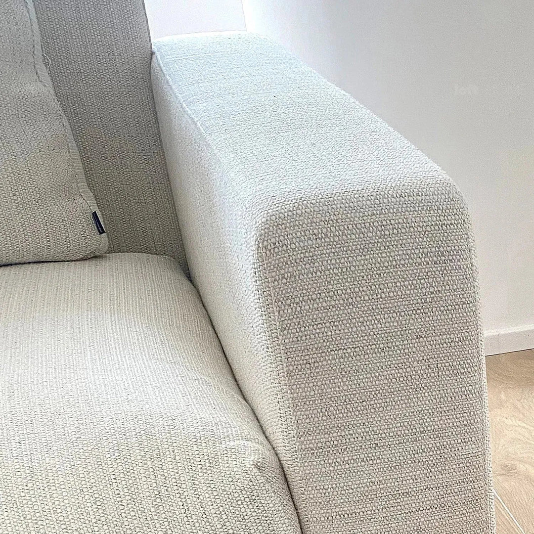 Minimalist fabric 4 seater sofa white in details.