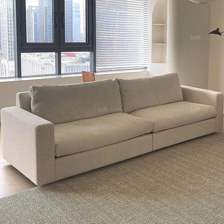 Minimalist fabric 4 seater sofa white in still life.
